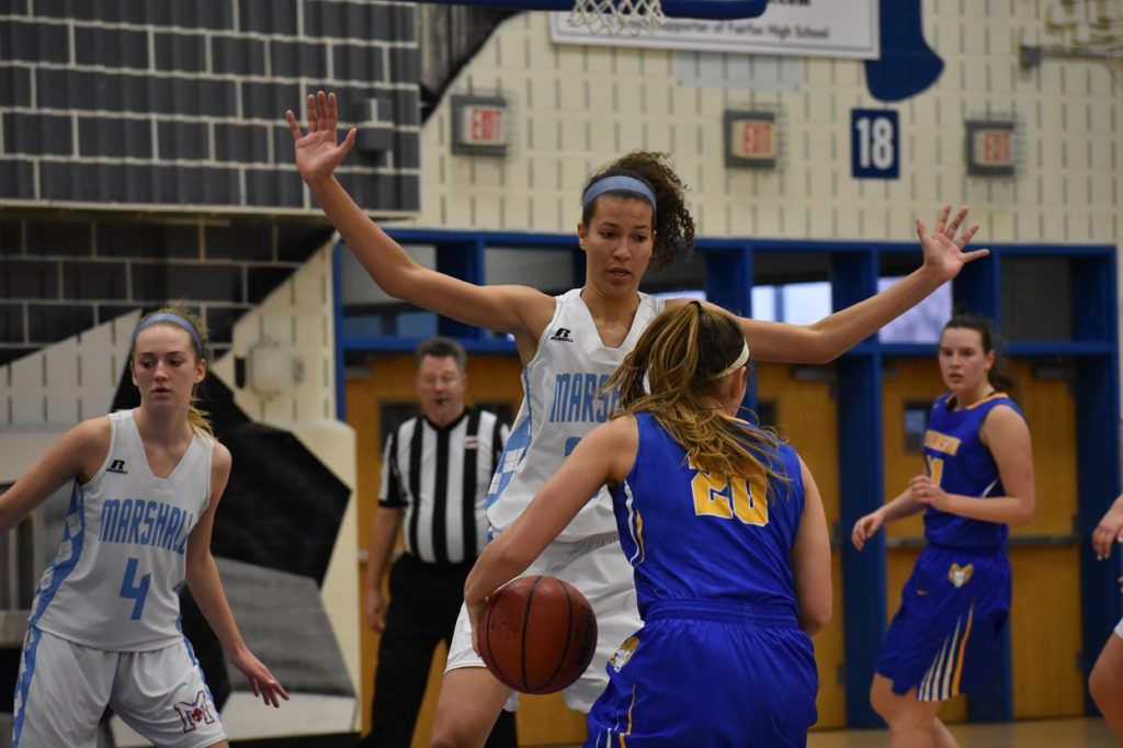 Marshall's Clara Ford (15 points) stops Robinson's Bella Edwards from penetrating.