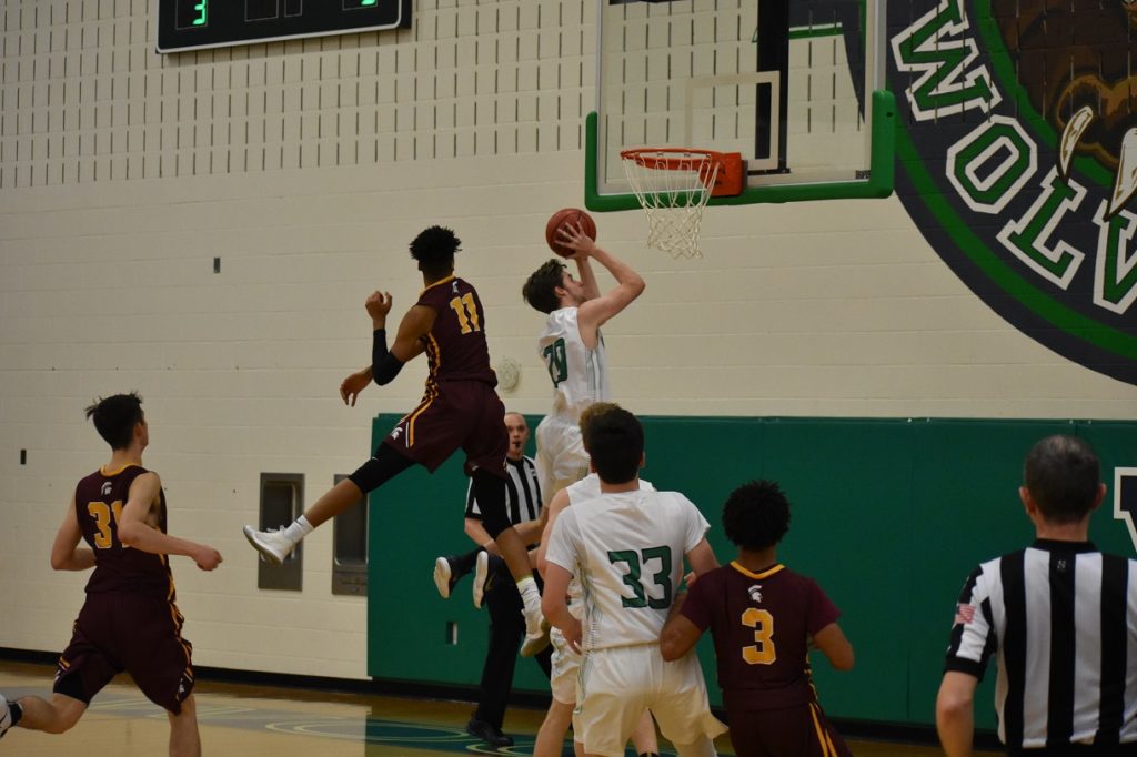 Woodgrove's Zachary Cunningham gets by the athletic Carman on his way to teh basket.