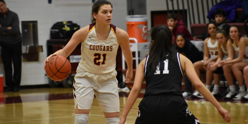 Oakton junior Grace Meshanko handles the ball on the perimeter. She also did damage inside (10 points, eight rebounds)