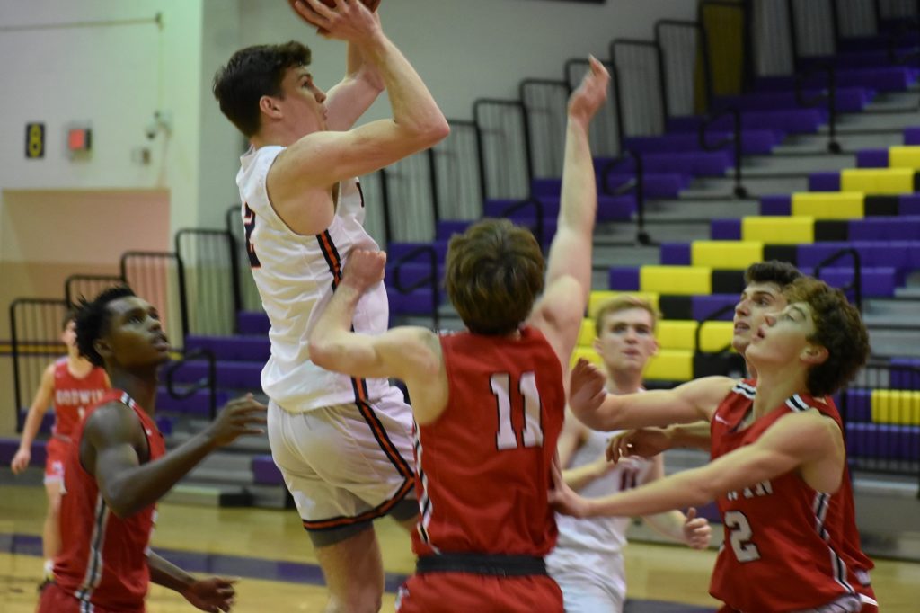 Senior Aidan Clark grabs an offensive rebound for a put-back with only seconds left in overtime.