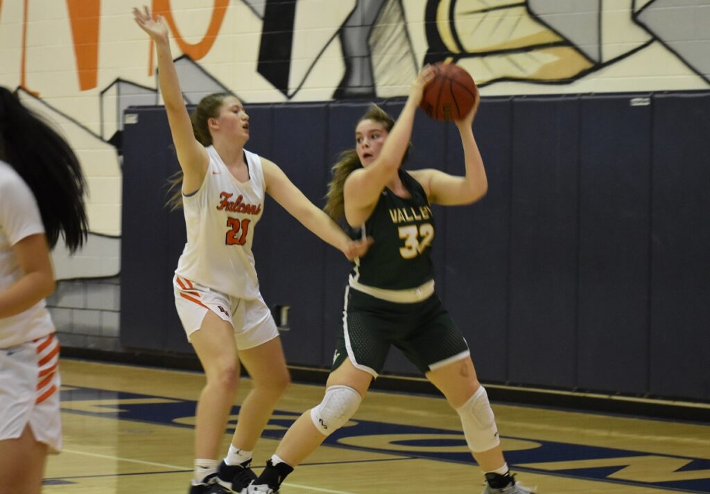 Valley senior forward Ally Cassell is guarded by Briar Woods sophomore Hope Drake. Both were key late.
