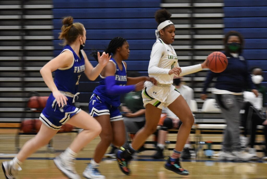 A host of Fairfax defenders trail Ka'mel Colbert after she gets the steal. Colbert (12 points, six boards, five assists) had a good all-around game.
