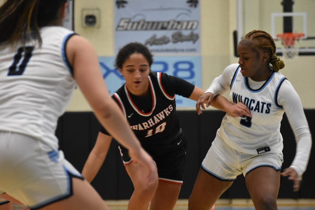 Madison's Kayla Dixon tries to get by Jahniya Marion and the tough Centreville defense in the first half Monday.